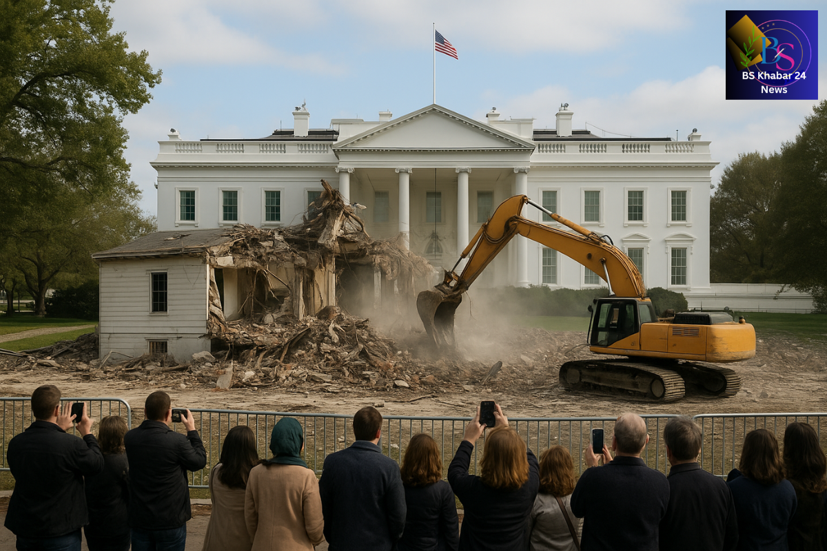 Trump East Wing Demolition, demolition crew uses heavy machinery to tear down a small structure on the White House grounds, while a group of people stand behind barricades taking photos. The main White House building stands intact in the background, and the BS Khabar 24 News logo appears in the top-right corner.